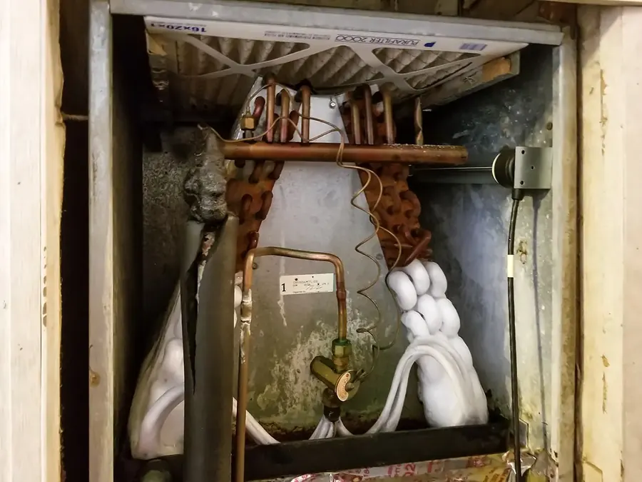 Neglected HVAC equipment with buildup and corrosion